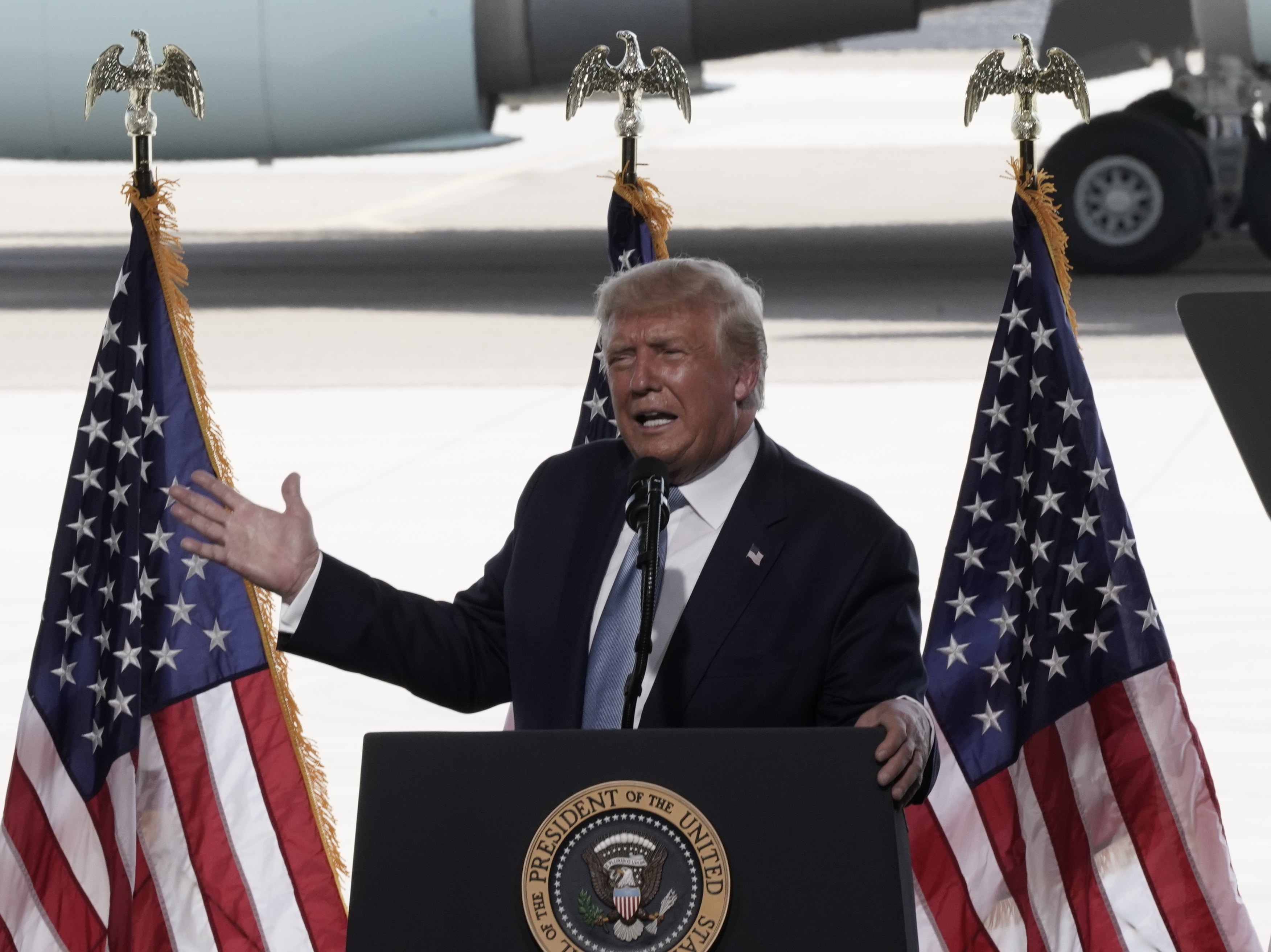 caption: President Donald Trump speaks during a campaign rally at Yuma International Airport in Arizona on Tuesday.