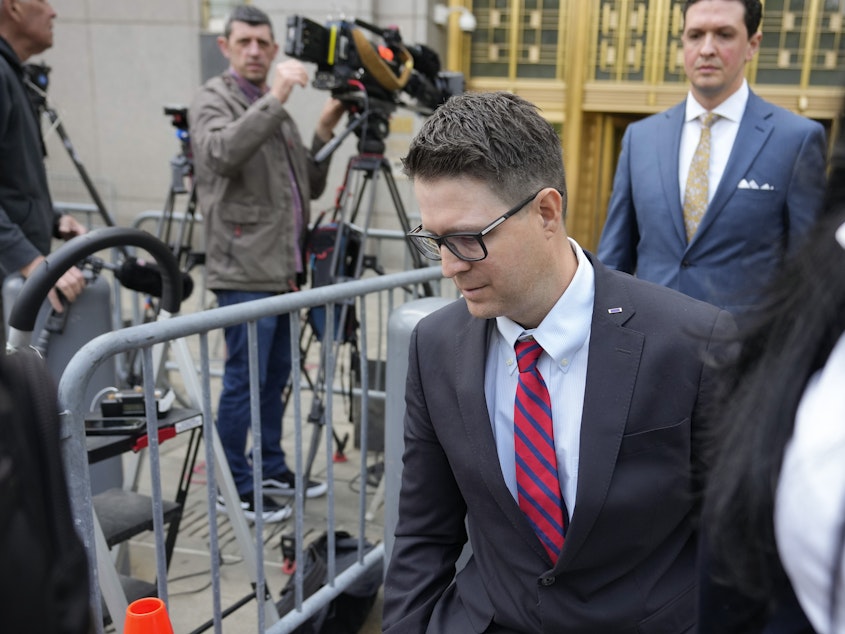 caption: Brian Kolfage leaves court in New York on Wednesday after being sentenced for defrauding donors to the We Build the Wall effort.