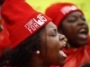 caption: Demonstrators call for a union and $15 minimum wage at a McDonald's in Charleston, S.C. in February 2020. The U.S. Senate has voted to prohibit an increase in the federal minimum wage during the pandemic.
