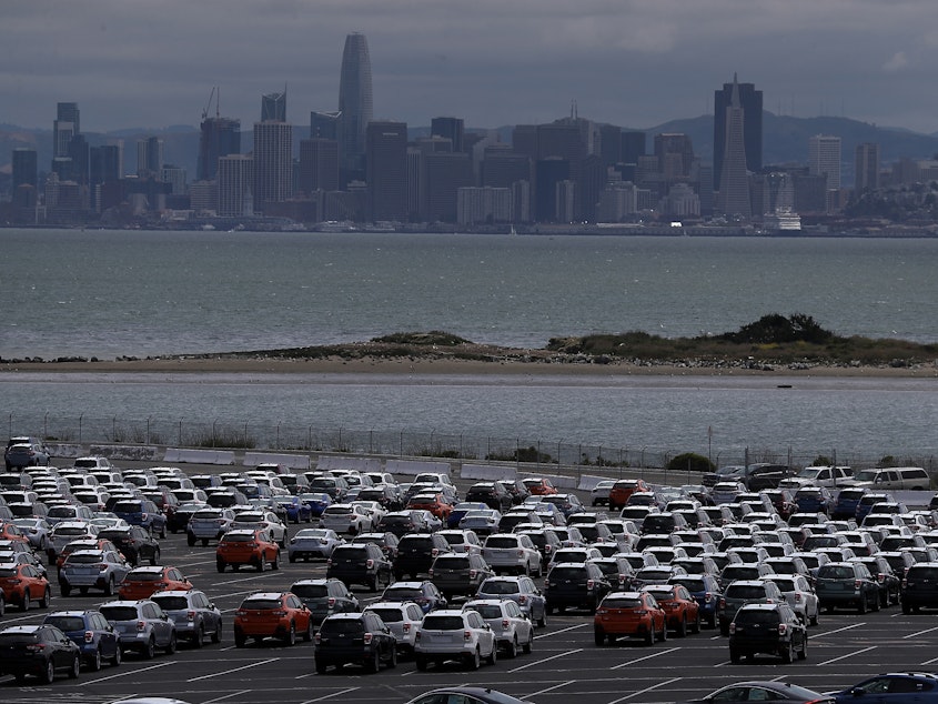 caption: New cars sit in a lot at the Auto Warehousing Co. near the Port of Richmond in Caliornia on May 24, 2018. President Trump has threatened to impose heavy tariffs on auto imports, but the White House has not announced a decision.