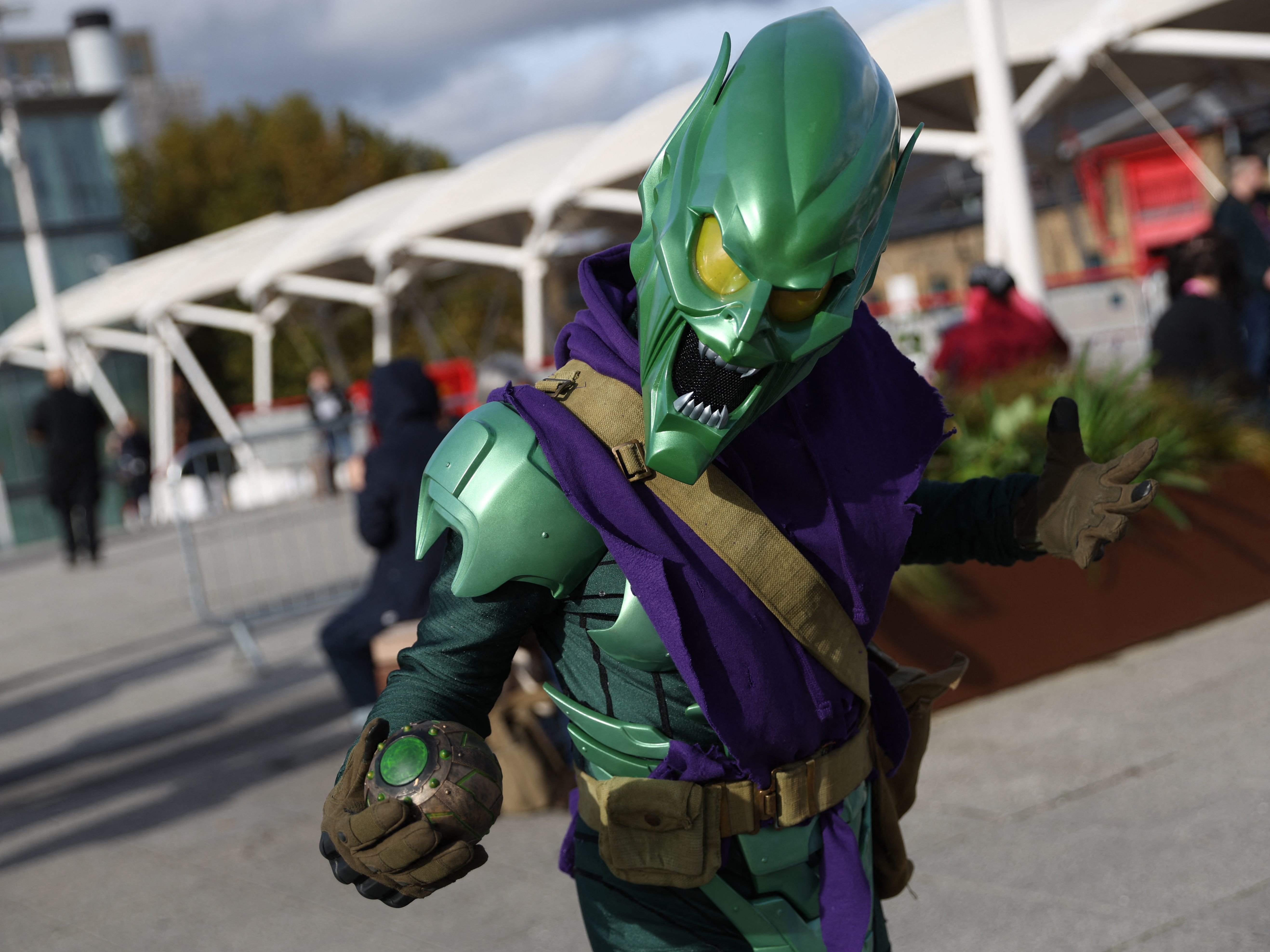 caption: A cosplayer dressed as the Green Goblin poses for a photograph on arrival to attend the MCM Comic Con at the ExCeL exhibition center in London on Oct. 28.