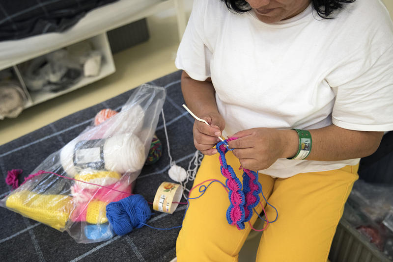caption: An immigrant detainee crochets at the Northwest Detention Center in Tacoma.
