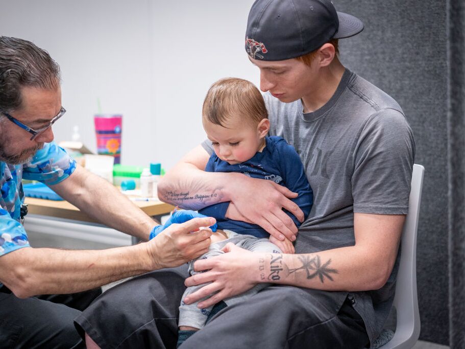 caption: A toddler gets the MMR vaccine at a vaccine clinic in Lubbock, Texas, during the measles outbreak in that state earlier this year.