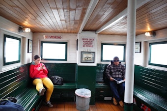 caption: Passengers on Kitsap Transit's Port Orchard -Bremerton ferry. Soon a modern vessel will take on a new route - Bremerton to Seattle. 