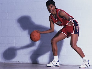caption: Lynette Woodard, pictured circa 1990, scored 3,649 points for the University of Kansas and went on to play professionally and for Team USA.