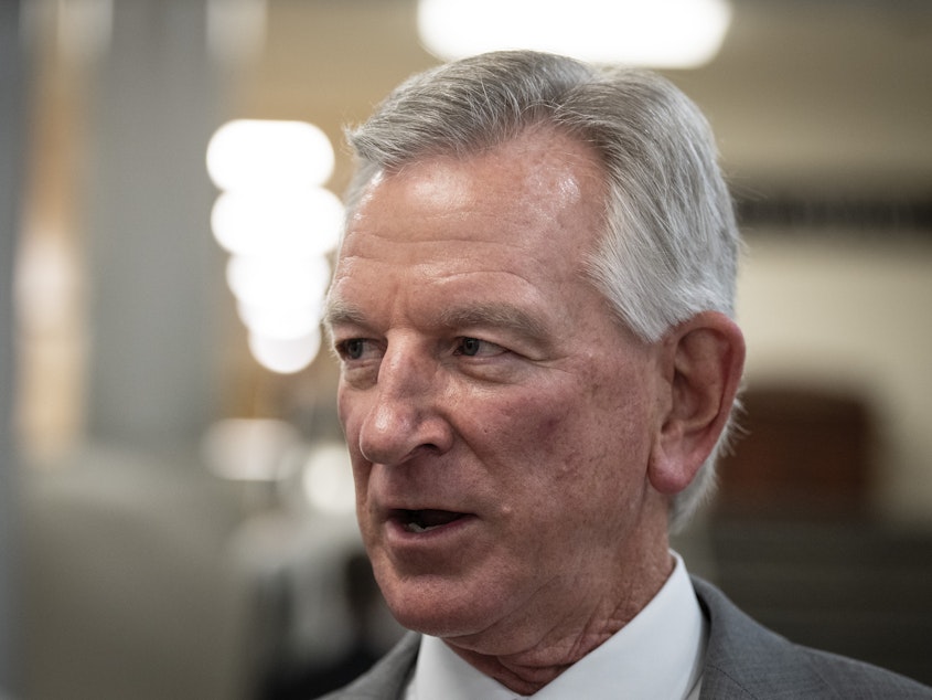 caption: Republican Sen. Tommy Tuberville, pictured here speaking to reporters in the U.S. Capitol on July 10, has blocked hundreds of military nominations, causing logistical hurdles across the service.