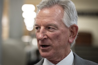 caption: Republican Sen. Tommy Tuberville, pictured here speaking to reporters in the U.S. Capitol on July 10, has blocked hundreds of military nominations, causing logistical hurdles across the service.