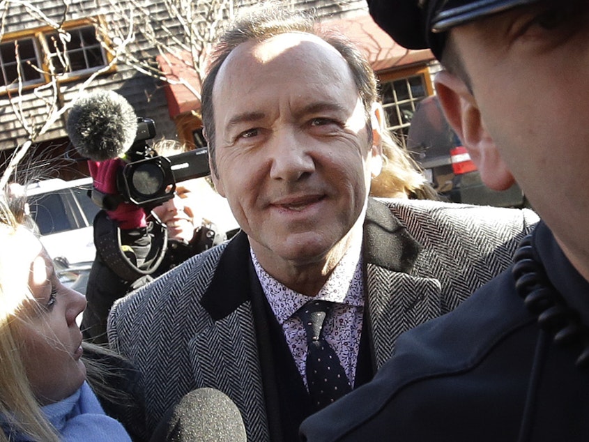 caption: Massachusetts prosecutors dropped criminal charges against actor Kevin Spacey on Wednesday. The Oscar-winner was accused of groping an 18-year-old man at a restaurant in 2016. Spacey is seen outside the courthouse in January.