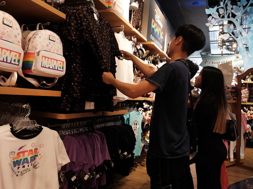 caption: People shop in a Manhattan store in New York City on July 27, 2023. The economy grew 4.9% in the July-September, a stunning pace of growth that was largely powered by strong spending from consumers.