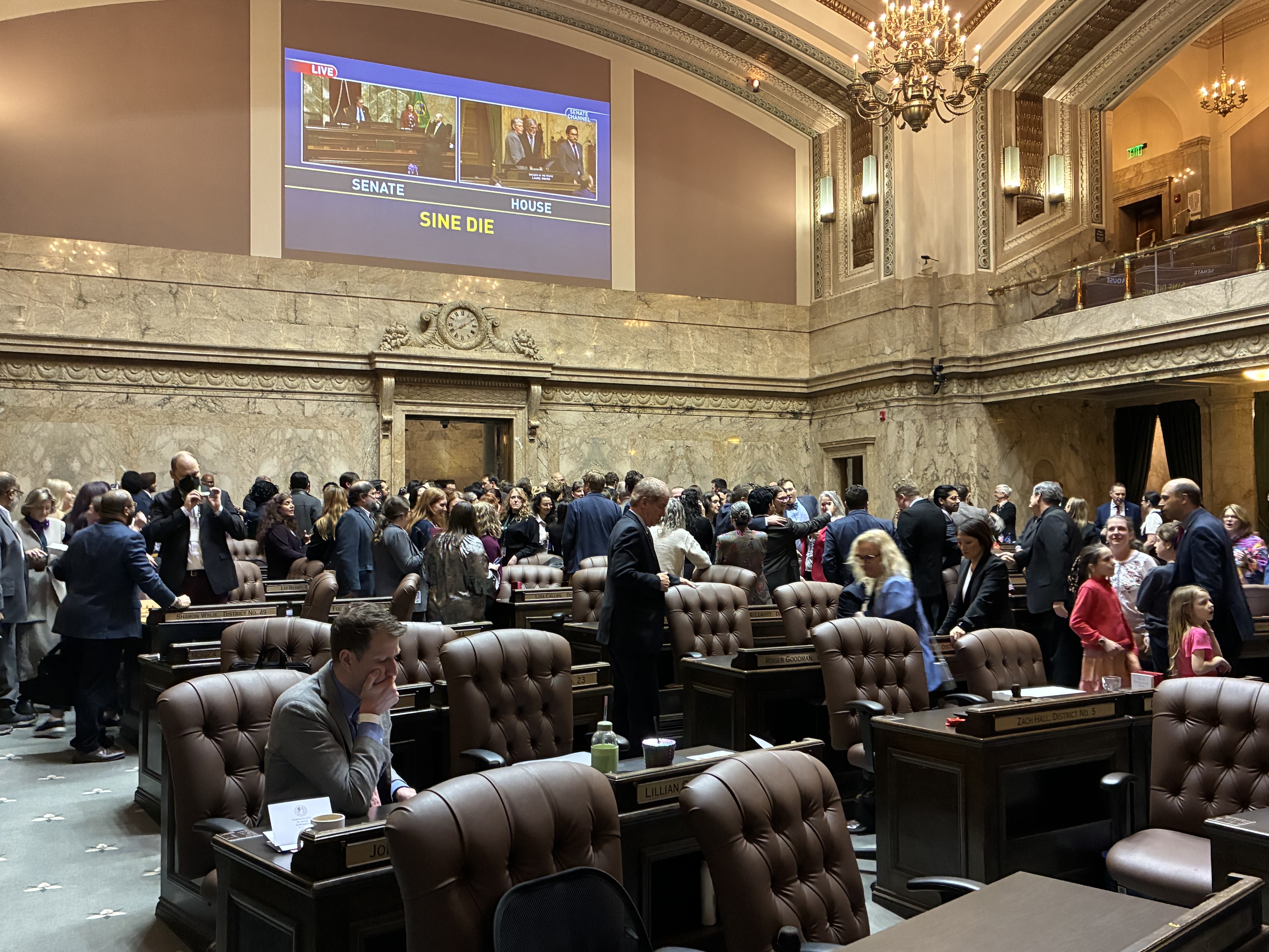 caption: Washington state legislators celebrated as the official end of session was announced on March 12, 2026, at the state Capitol in Olympia.