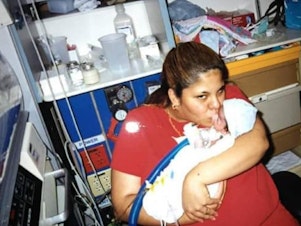 caption: Tarah and Isaiah Acosta are seen in the hospital about a month after Isaiah's birth.