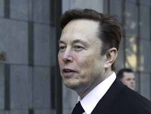 caption: Elon Musk departs the Phillip Burton Federal Building and United States Court House in San Francisco, on Tuesday, Jan. 24, 2023.