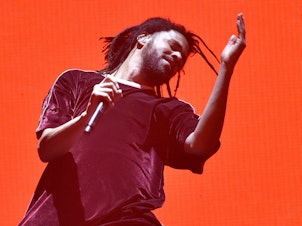 caption: J. Cole, onstage in Oakland this summer, refracted hip-hop through an absurdist lens on <em>KOD</em>.