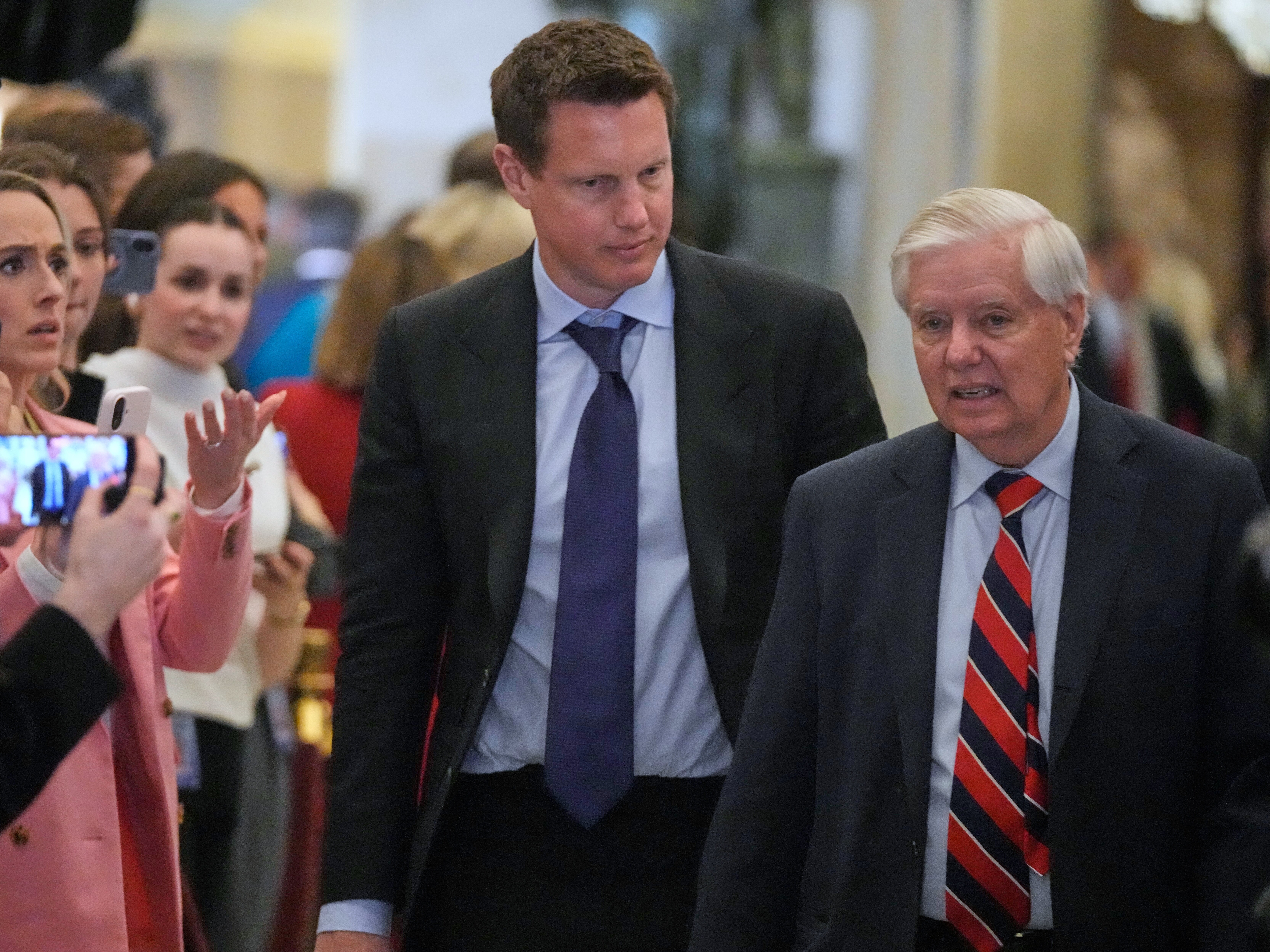 caption: Paramount CEO David Ellison arrives with Sen. Lindsey Graham, R-S.C., before President Donald Trump delivers the State of the Union  in the House chamber at the U.S. Capitol in Washington, Tuesday, Feb. 24, 2026.