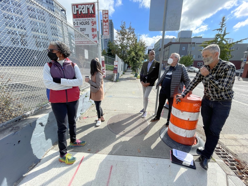 caption: Tom Graff (R) and members of Belltown United meet with school board candidates Michelle Sarju (L) and Vivian Song Maritz (2nd from L) to talk about the proposed school site in Belltown
