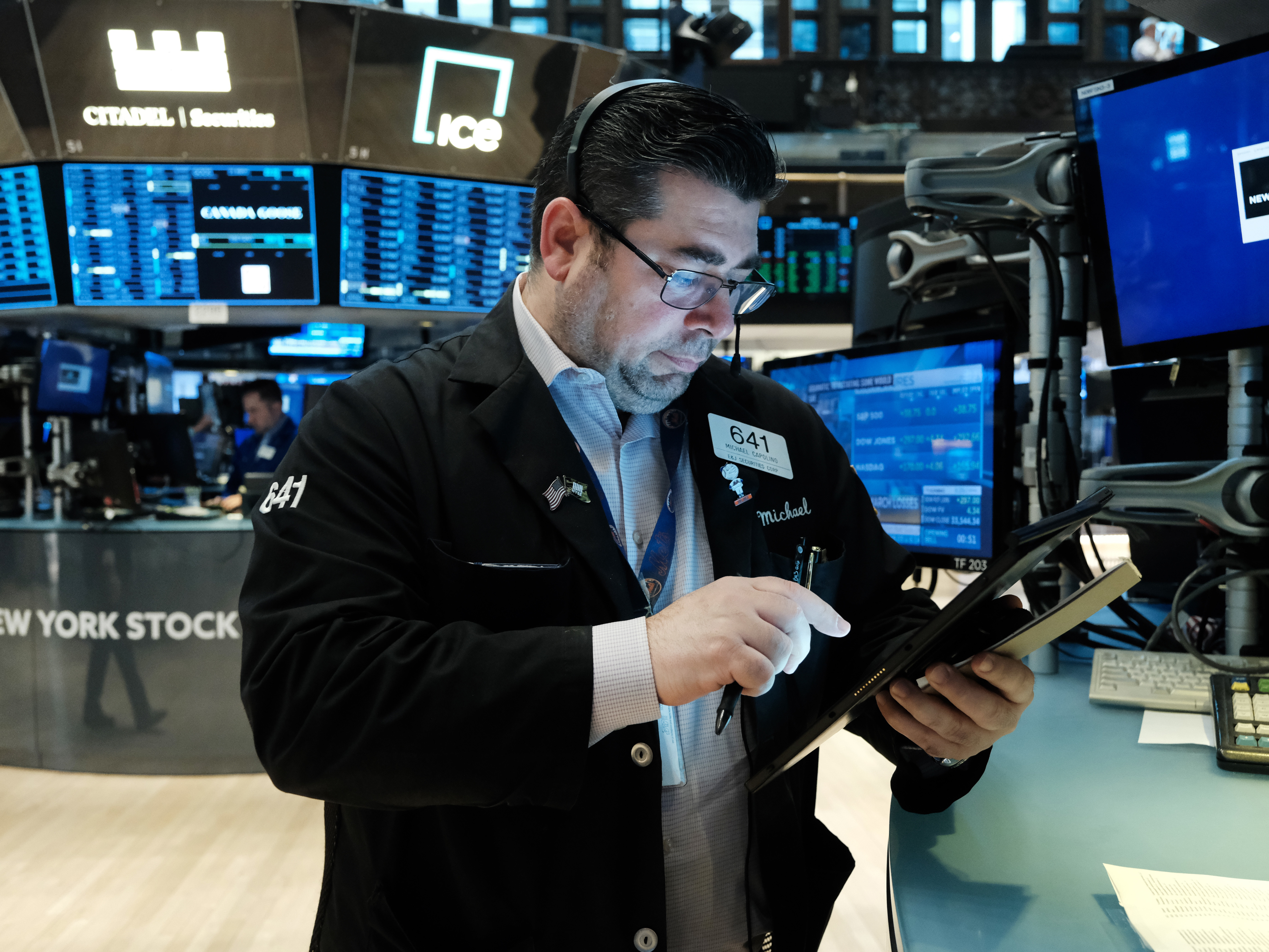 caption: Congress is debating legislation banning lawmakers from trading individual stocks. There is already a Senate rule requiring committee aides to divest stocks of any businesses they oversee.