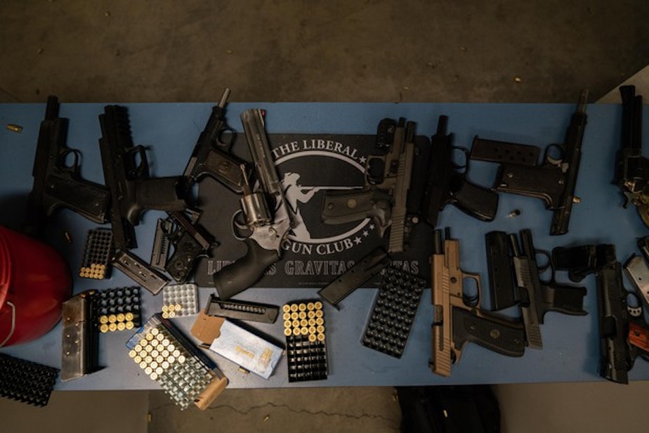 caption: <p>Guns are splayed out at the gun range during The Liberal Gun Club’s winter range day on Jan. 26, 2019 in Portland, Ore.</p>