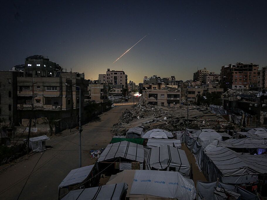 caption: Iranian rockets heading toward Israel are seen crossing the sky over Gaza City on March 3, 2026, as they travel toward Israeli territory amid escalating regional tensions.