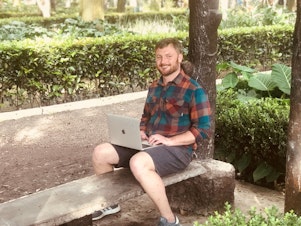 caption: Curtis Berryman working in a park in Mexico City