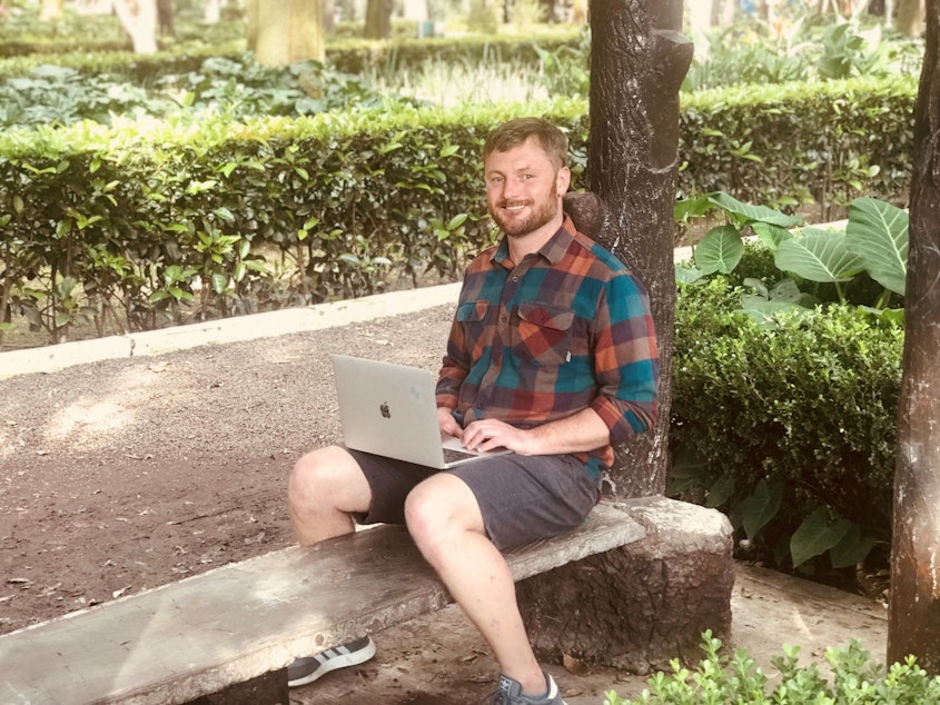 caption: Curtis Berryman working in a park in Mexico City