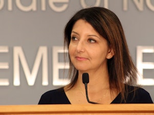 caption: Mandy Cohen speaks at a news conference in 2021.