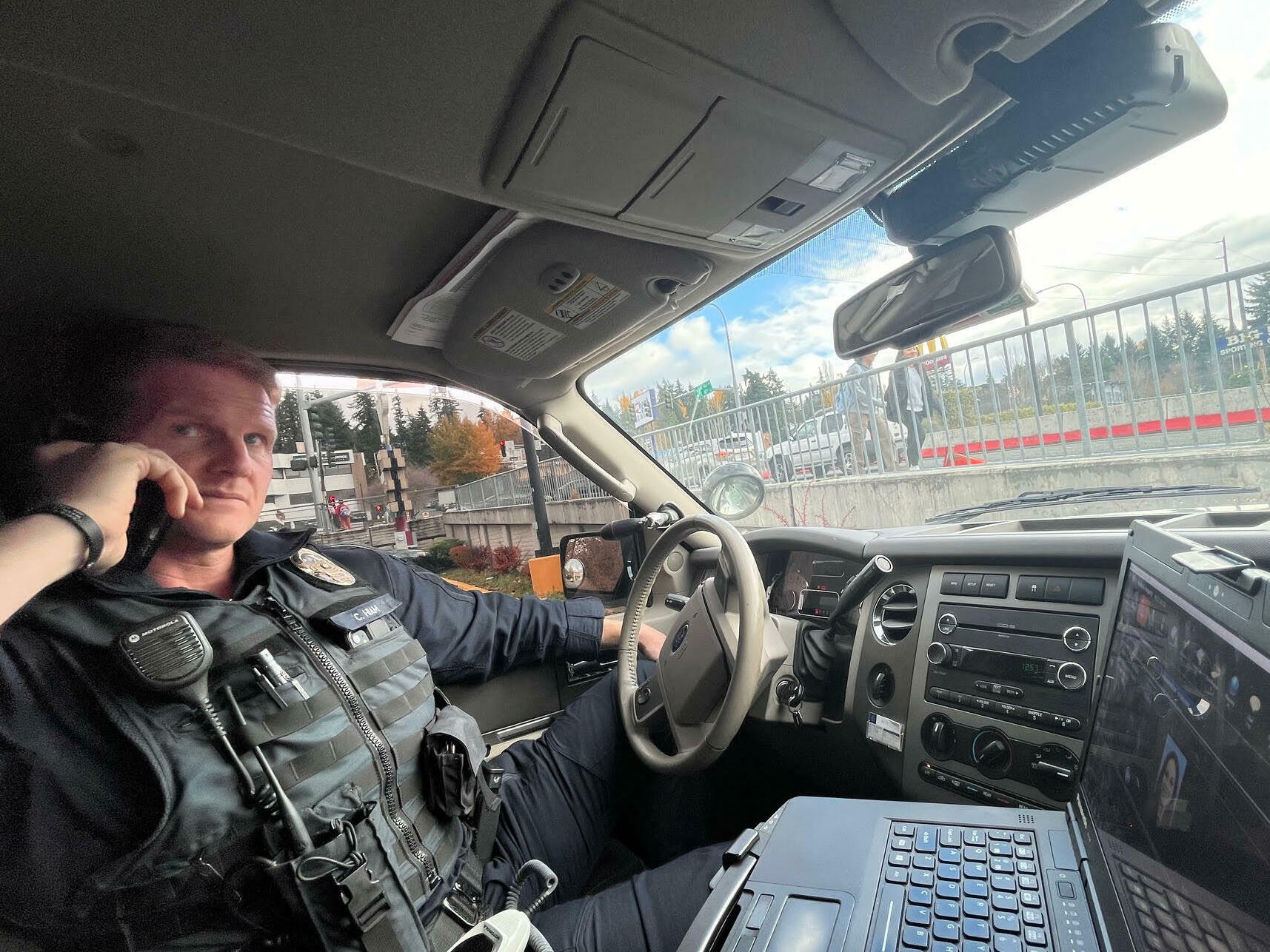 caption: Sgt Casey Hiam of the Bellevue. WA police department on an anti-shoplifting stakeout operation during the holiday shopping season