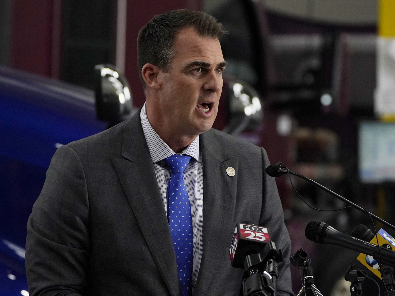 caption: FILE - Oklahoma Gov. Kevin Stitt speaks during a news conference, Monday, May 17, 2021, in Oklahoma City. Gov. Stitt has signed a bill into law that bans the teaching of critical race theory in Oklahoma schools.