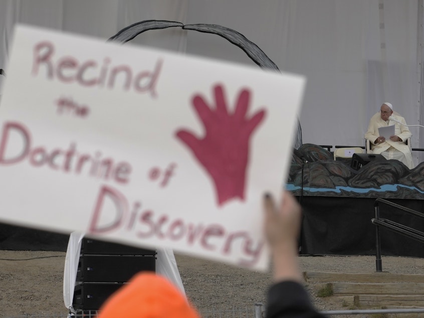 caption: People protest as Pope Francis meets young people and elders at Nakasuk Elementary School Square in Iqaluit, Canada, last July. The Vatican on Thursday formally repudiated the "Doctrine of Discovery." The theory is backed by 15th century papal decrees that legitimized the colonial-era seizure of Native lands and form the basis of some property laws today.