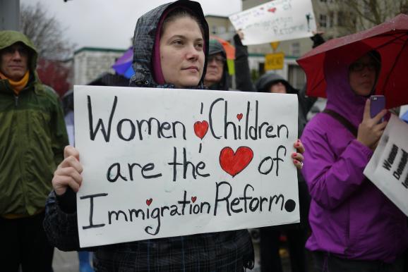 caption: Thirty-three women staged a sit-in at the state’s Republican Party headquarters in Bellevue on Nov. 7, 2013. The protesters called on their representatives to take action on immigration reform.
