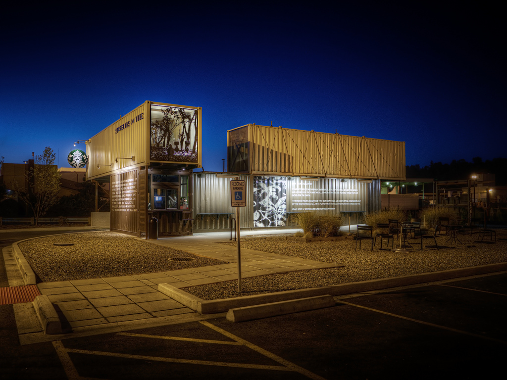 caption: Starbucks has been rolling out drive-through, walk-up locations made out of recycled shipping containers. This location is in Tukwila, Washington.