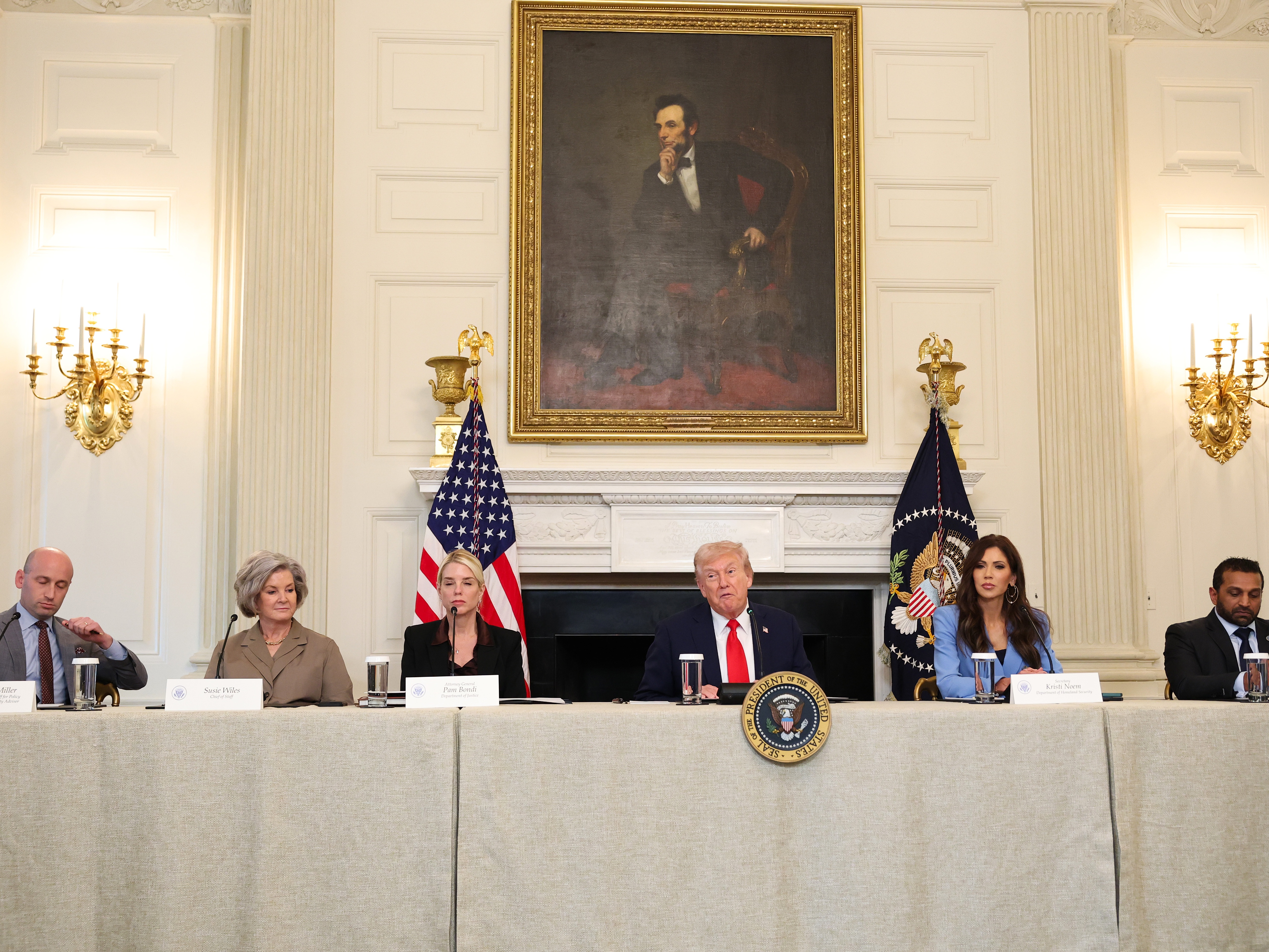 caption: President Trump speaks as (L-R) White House Deputy Chief of Staff Stephen Miller, White House Chief of Staff Susie Wiles, Attorney General Pam Bondi, Secretary of Homeland Security Kristi Noem and Federal Bureau of Investigation Director Kash Patel listen during a roundtable discussion at the White House on Oct. 8. The administration held the roundtable to discuss the antifa movement after the president signed an executive order designating it as a "domestic terrorist organization."