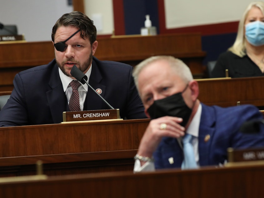 caption: House Homeland Security Committee member Rep. Dan Crenshaw, R-Texas, questions witnesses during a hearing Thursday on threats to the United States.