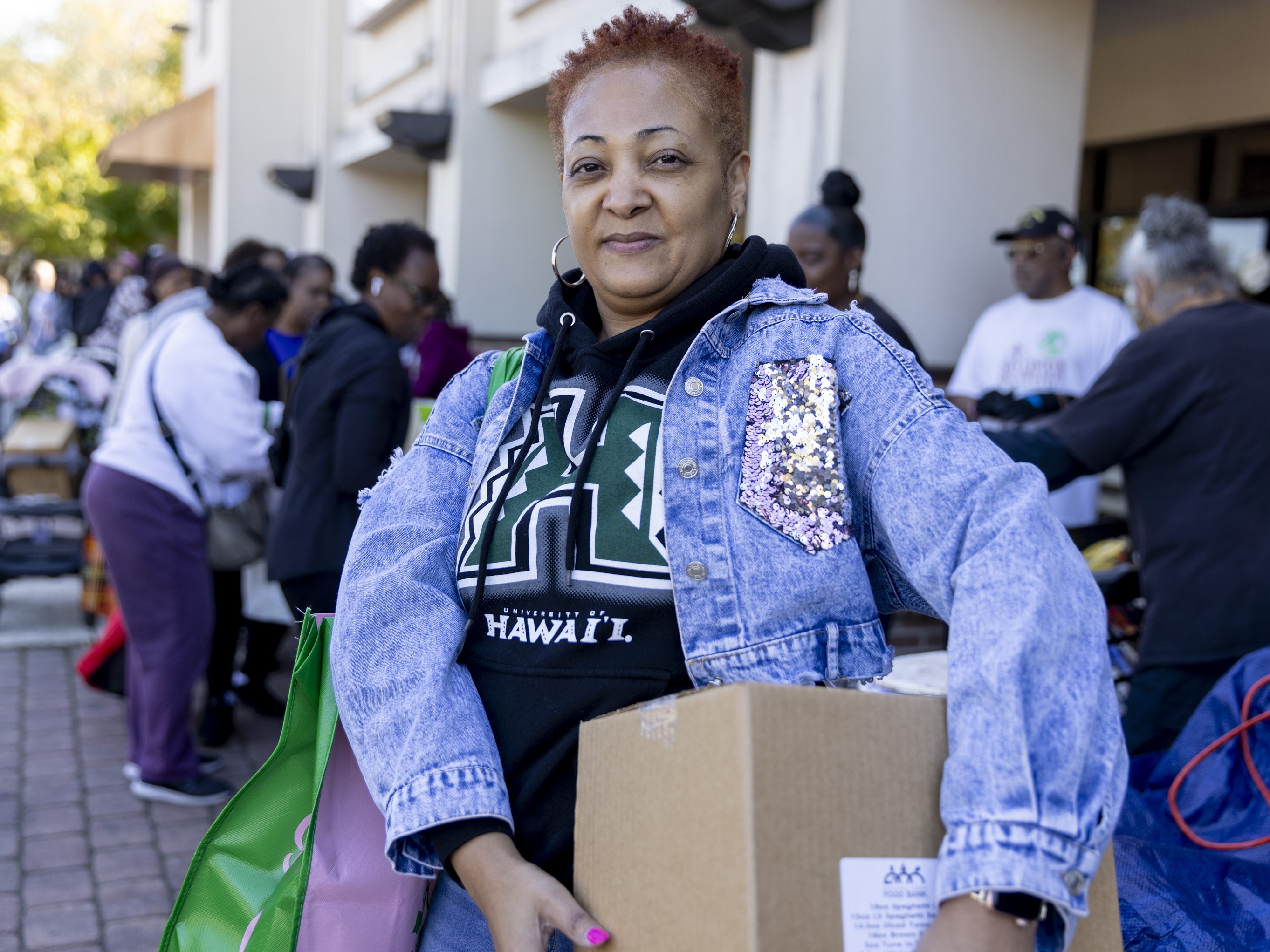 caption: Wanda Bright, a federal worker affected by the shutdown, picks up food from the Capital Area Food Bank in Hyattsville, Md., on Tuesday.