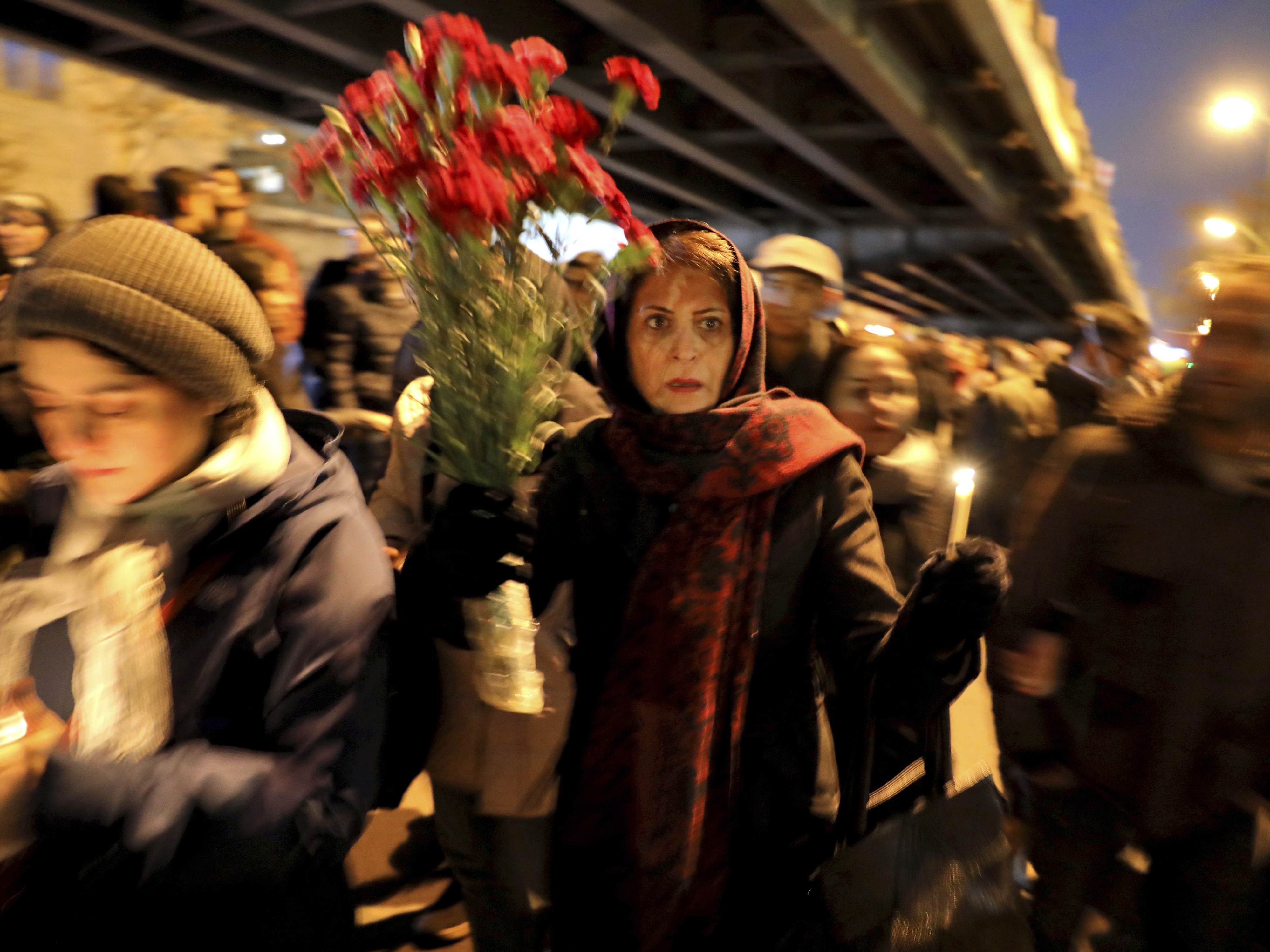 caption: Mourners gathered for a candlelight vigil Saturday in Iran's capital, Tehran, to remember the victims of the Ukrainian plane crash.