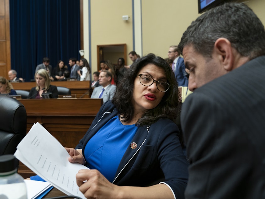 caption: Rep. Rashida Tlaib, D-Mich., pauses as the House Oversight and Reform Committee votes on Wednesday to hold Attorney General William Barr and Commerce Secretary Wilbur Ross in contempt for failing to turn over subpoenaed documents related to the Trump administration's decision to add a citizenship question to the 2020 census.
