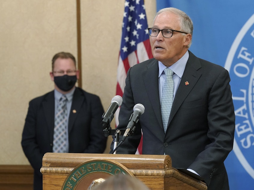 caption: Washington Gov. Jay Inslee speaks at a news conference at the state Capitol in Olympia.