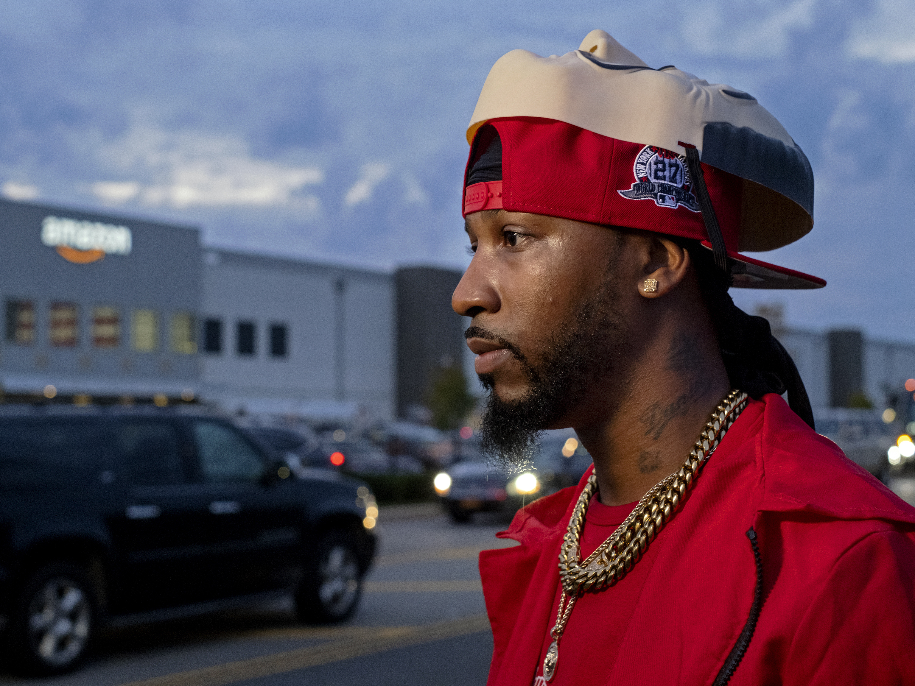 caption: Chris Smalls, president of the Amazon Labor Union, takes part in an interview at the Amazon distribution center in the Staten Island borough of New York on Oct. 25, 2021, after earlier delivering "Authorization of Representation" forms to the National Labor Relations Board in New York.