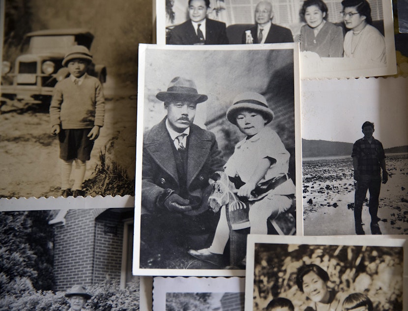 caption: Family photos, including one of 2-year-old Jerry Yamashita with his father, Masahide Yamashita, are shown on Friday, Feb. 9, 2018, in Seattle.
