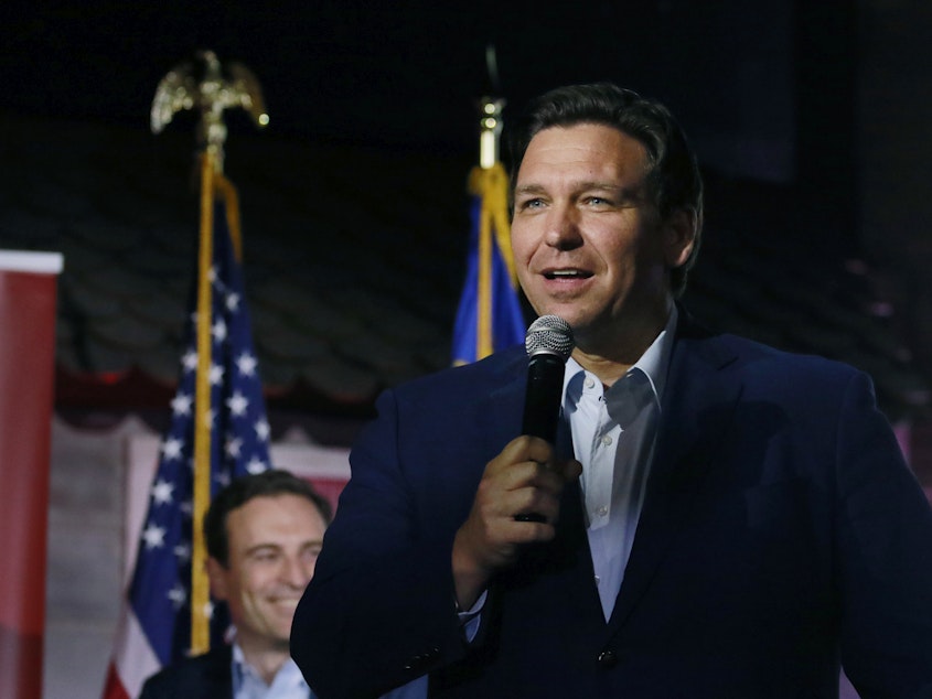 caption: Florida Gov. Ron DeSantis is being sued on behalf of migrants who were flown to Martha's Vineyard last Wednesday without warning.