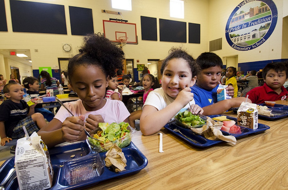 caption: Students try the new school lunch menu at the Yorkshire Elementary School in Manassas, Virginia, Sept. 7, 2012.