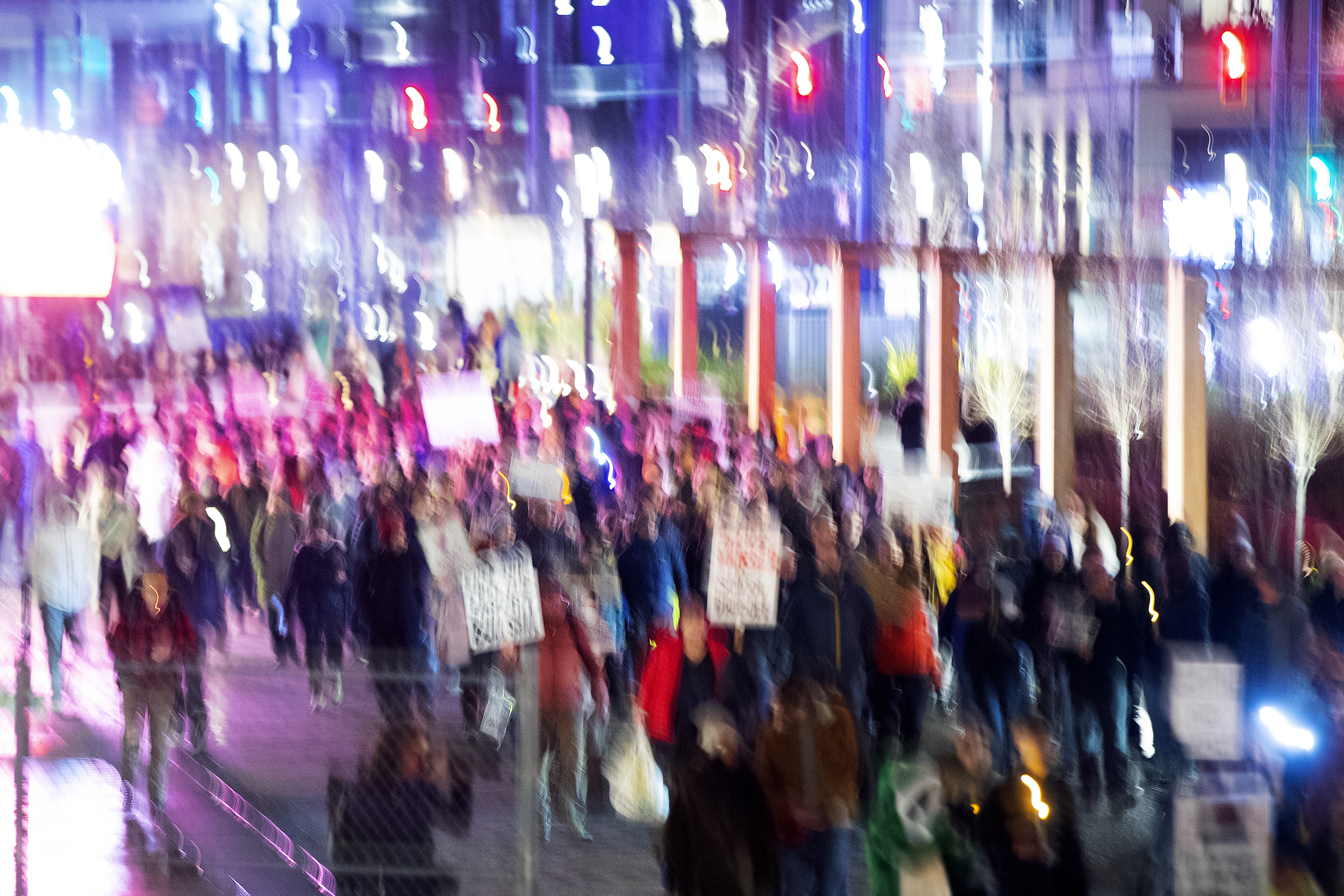 caption: Hundreds march along the waterfront following a vigil honoring Renee Nicole Good, the Minneapolis mother of three who was shot in the head and killed by an ICE agent earlier this week, on Thursday, January 8, 2026, at Pier 58 in Seattle. 