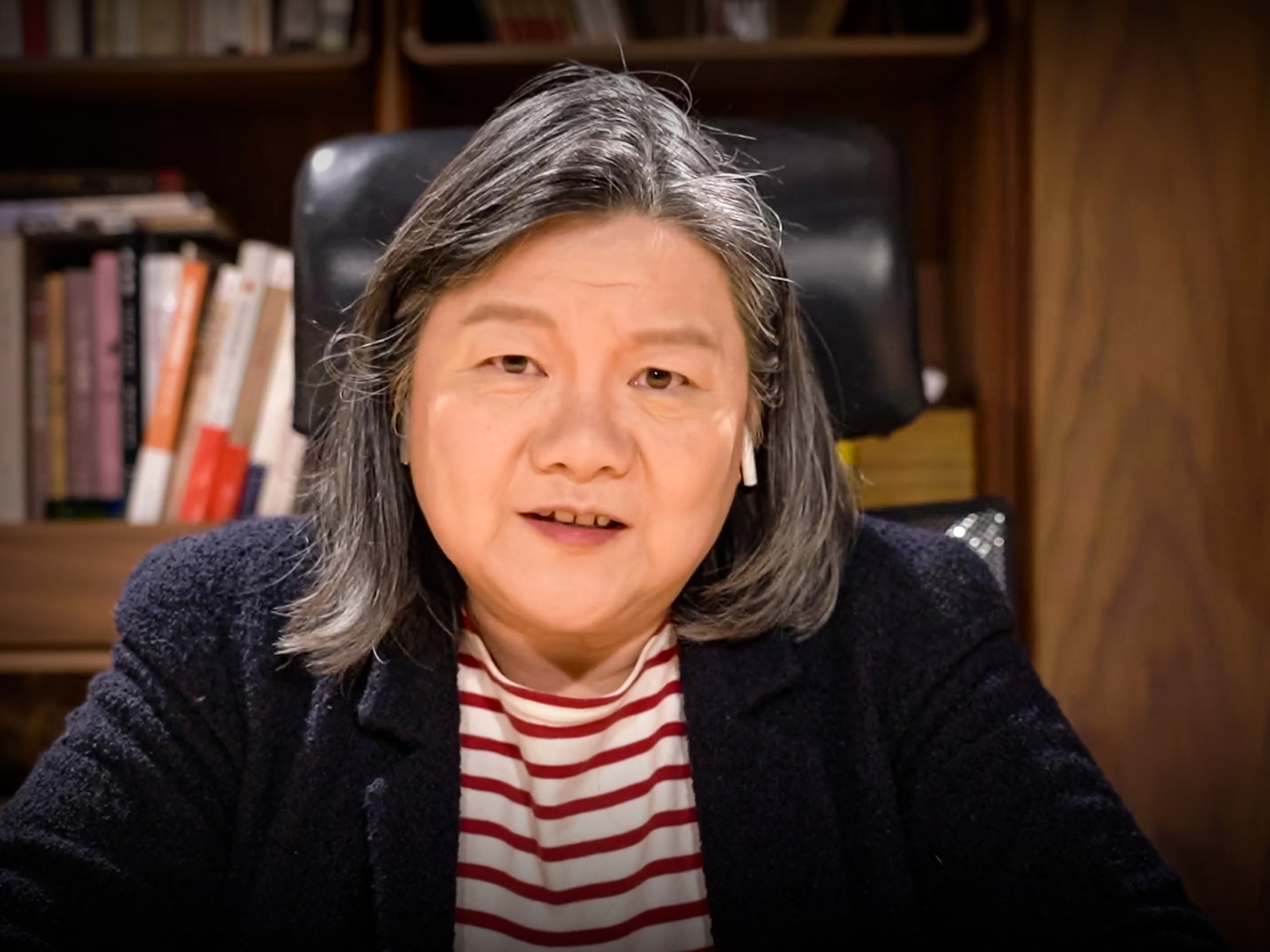 caption: Huang Hung in conversation with TED's Helen Walters.