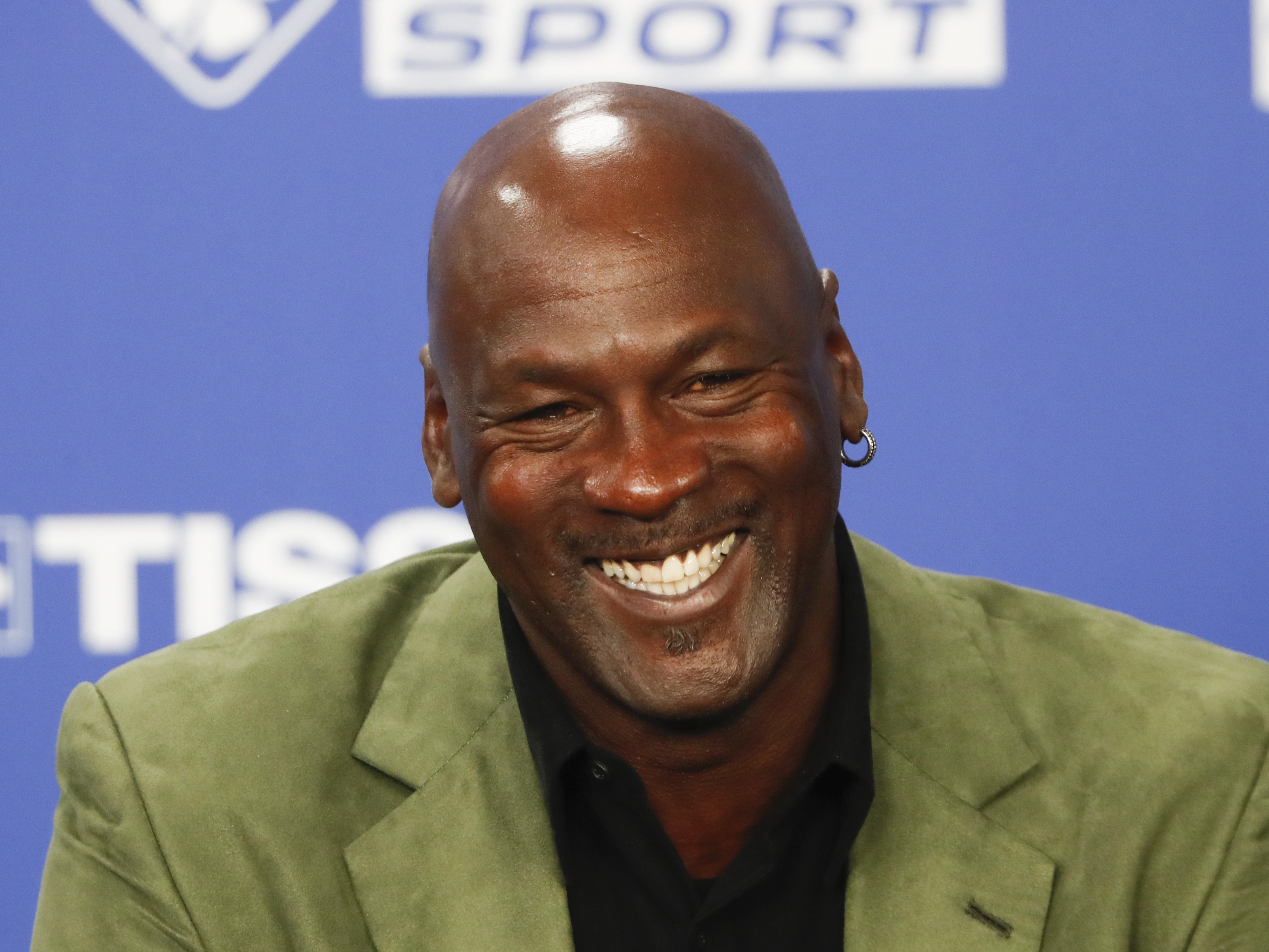 caption: Basketball legend Michael Jordan speaks during a press conference ahead of an NBA basketball game between the Charlotte Hornets and Milwaukee Bucks in Paris, Jan. 24, 2020.