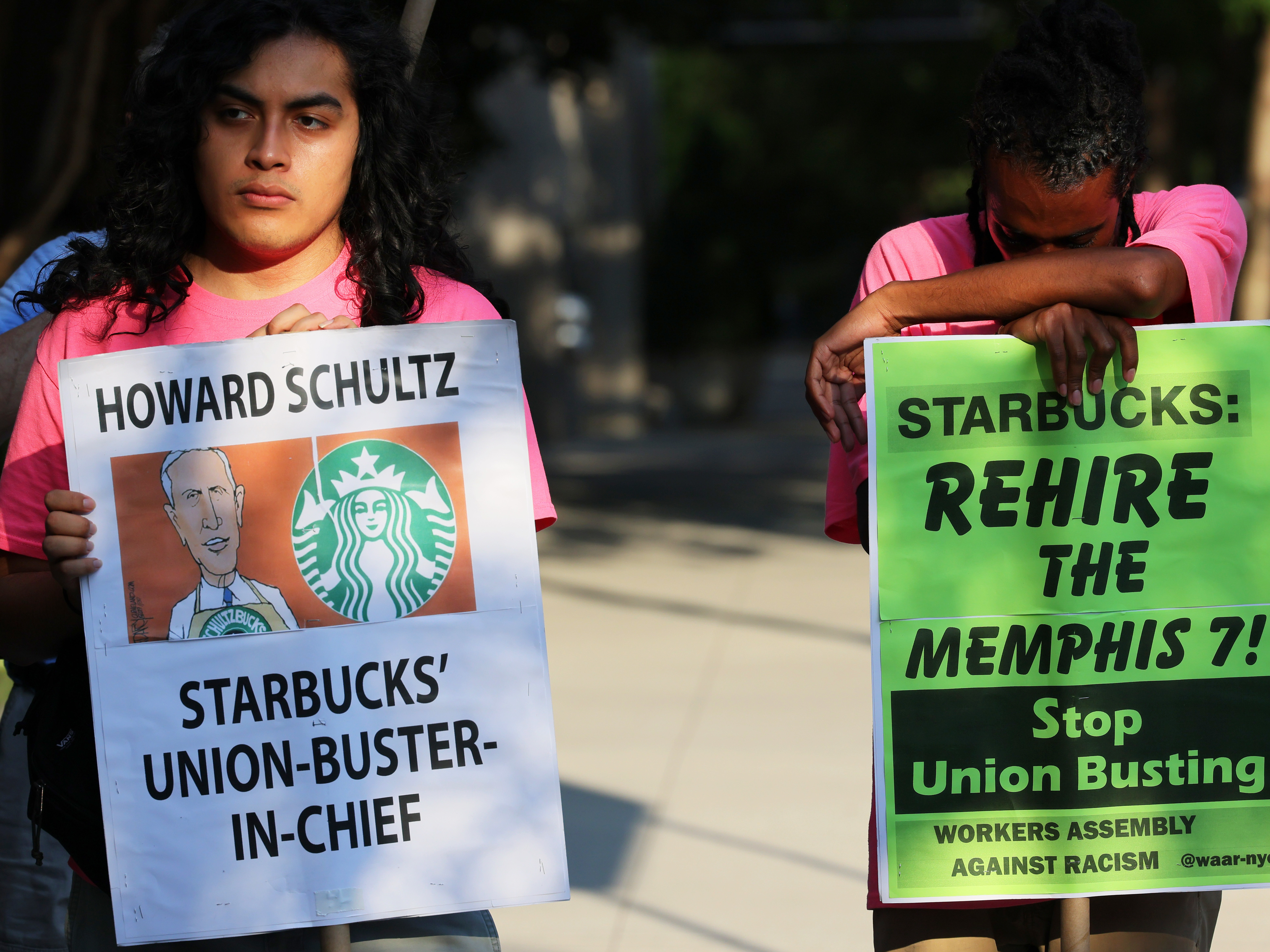 caption: Starbucks says regional staff of the National Labor Relations Board repeatedly crossed the line of neutrality to help union organizers in Kansas. Here, activists protest against Starbucks CEO Howard Schultz in New York City last month.