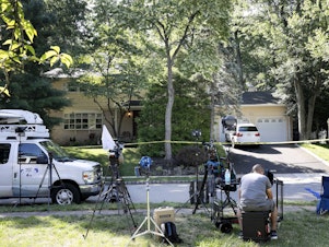 caption: News media set up in front of the home of U.S. District Judge Esther Salas on Monday in North Brunswick, N.J. A gunman posing as a delivery person shot and killed Salas' 20-year-old son Sunday.