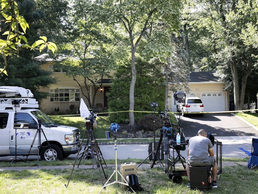 caption: News media set up in front of the home of U.S. District Judge Esther Salas on Monday in North Brunswick, N.J. A gunman posing as a delivery person shot and killed Salas' 20-year-old son Sunday.