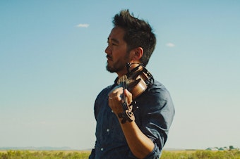 caption: Kishi Bashi's <em>Omoiyari, </em>out May 31, is largely inspired by the artist's visit to ex-internment camps in America.
