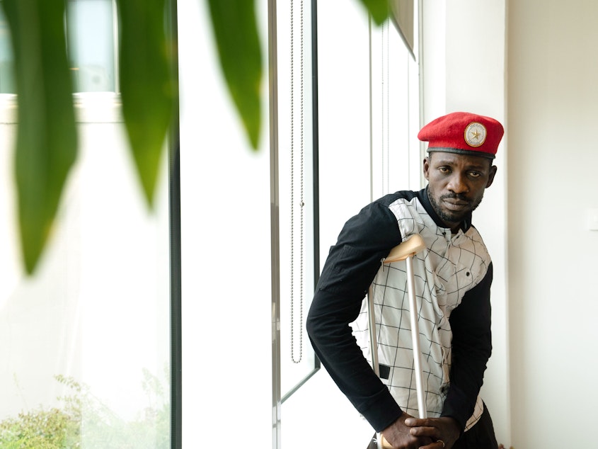 caption: Ugandan politician and musician Bobi Wine has led opposition to Uganda's president, who has been in power since 1986. Wine says soldiers tortured him, but he will return to Uganda.