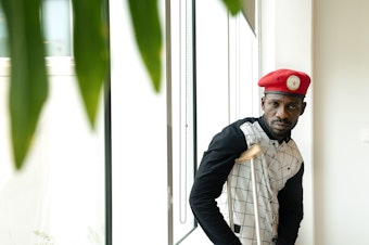caption: Ugandan politician and musician Bobi Wine has led opposition to Uganda's president, who has been in power since 1986. Wine says soldiers tortured him, but he will return to Uganda.