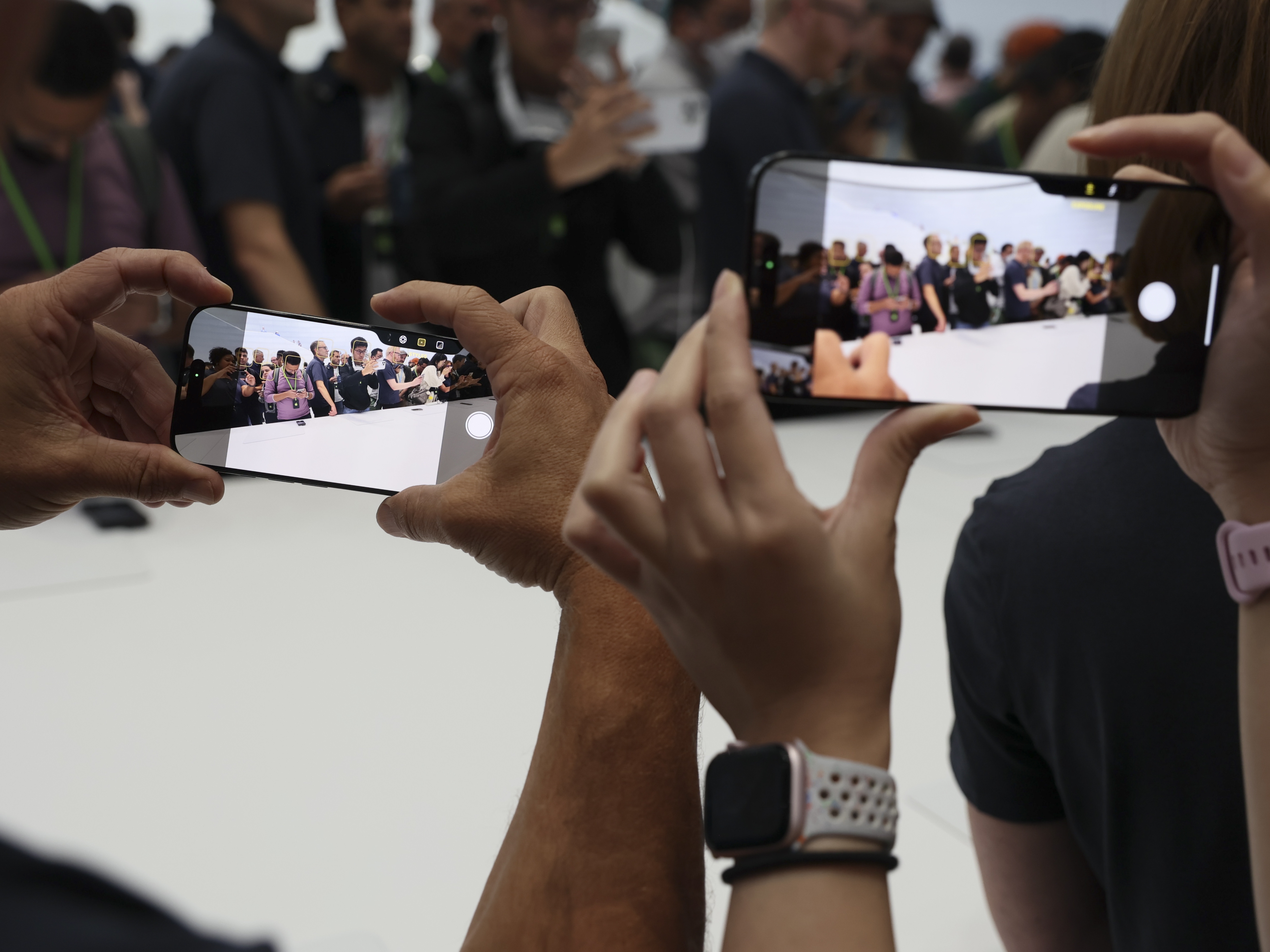 caption: The new iPhone 16 is displayed at Apple headquarters on Monday in Cupertino, Calif. 